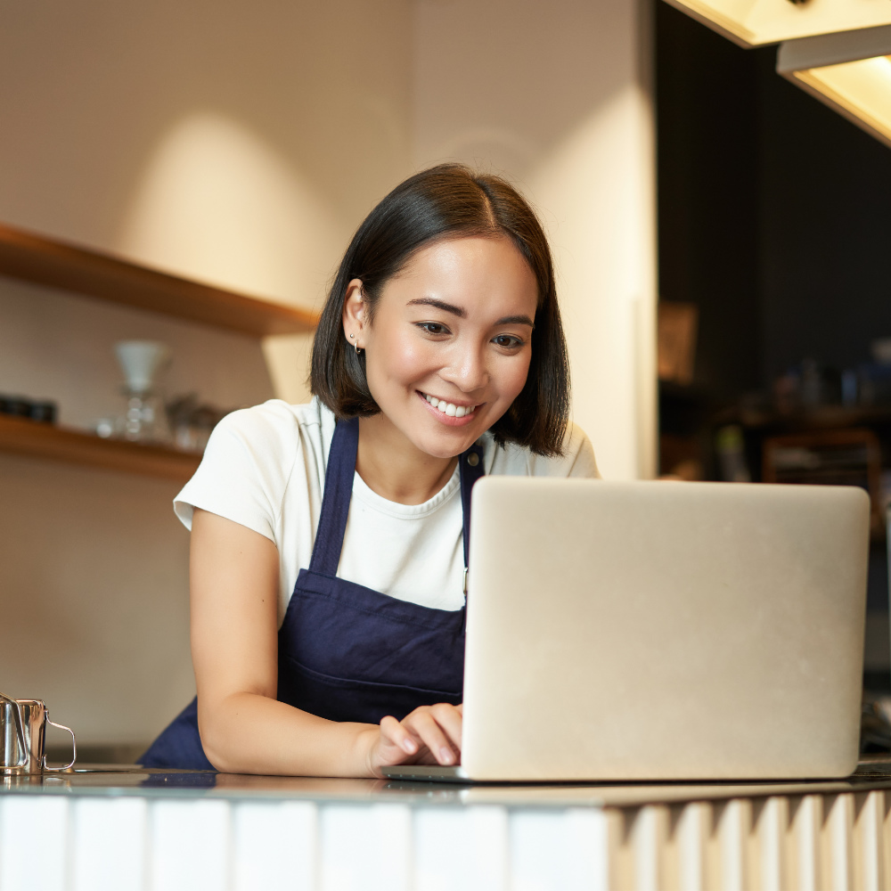 Business owner working on laptop